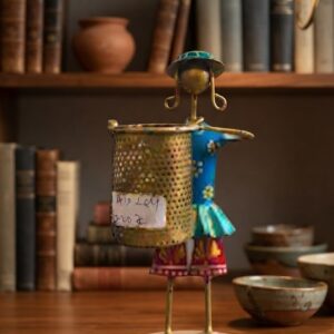 AN-264 ( Rustic Metal Village Girl Pen Holder )