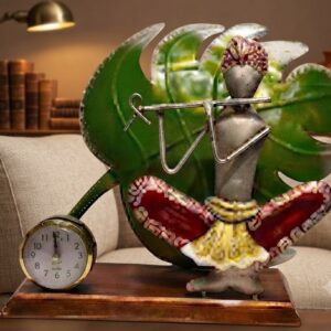 M-1449 ( Handcrafted Krishna Flute Metal Table Clock with Decorative Leaf Backdrop )